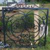 Single wrought iron gate painted Charleston Green.